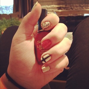 favourite nail design.. love mixing red and gold together. the black cheetah prong and cross add a nice touch too :') 