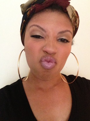 Can't go wrong with glossy purple lips, big gold hoops and a head wrap