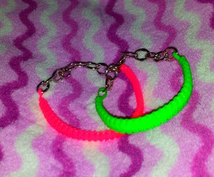 im selling these bracelets In any color u want orange pink purple green yellow blue and red for 3$ ea :). email me at Kkuteness@gmail.com if your interested :)