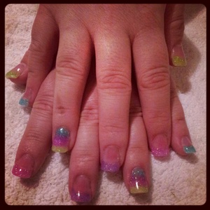 Acrylic extensions with Pink, blue, green and purple acrylic powder with top coat