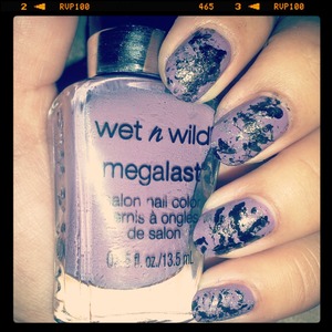 did some splattered nails with the saran wrap method using a purple base and black and silver splatter :)