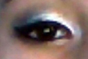 the quality of my camera isn't good, but my version of a smokey eye; Used Maybelline Color Tattoo in Too Cool, Estee Lauder's eye shadow in Amazing Grey, Elf Liquid Eyeliner, and Maybelline Eye Studio Gel Liner on my waterline.