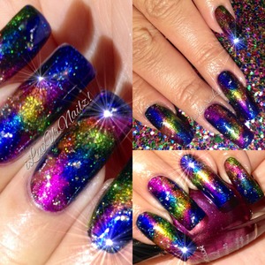 At first they were suppose to be my version of Galaxy Nails but it turned out to match the glittery background I use LOL any how I LOVE how they came out. 
The colors I used to achieve this look are (& there's a lot)...For my base I used Essies Grow Stronger,  then 1 coat of China Glazes Liquid Leather as my base color, KleanColors Metallic Sapphire, Metallic Fuchsia, Metallic Green, Metallic Mango, Metallic Pink and China Glazes Fairy Dust & added some random glitters from China Glazes Make A Spectacle topped it off with my fav top coat Seche Vite. 