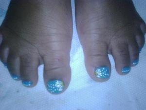 White flowers on my daughter's blue toe nails :)
