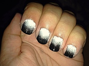 I made black, silver and white ombré nails, it's very easy, and all you need is a sponge, and then you put a layer of white polish on your nails, then you take the sponge and put a stripe of white polish, silver polish and black polish, and then you sponge it on your nails a couple of times and in the end you want to put a layer of top cote on, and then your done!
