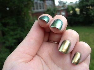 A swatch of OPI's Just Spotted the Lizard. I tried getting a good photo of the gold/green duochrome.