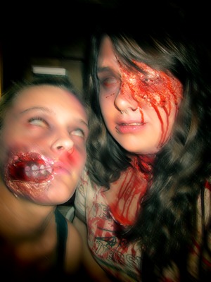 Over the weekend Chicago was having their 5th Annual Zombie walk! So me and my friends got together and gored ourselves up!
(I obviously edited this picture!) I'm the girl on the right, I did all my own makeup. 
My friend on the left did her own! Looks pretty awesome!