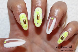 The "deep v cut out nails" are inspired by Nina Nailed it.

♡ Products I used ♡
"Sun- Kissed" by China Glaze (neon yellow)
Nr. M103 by f.flormar (white)
Round studs: http://www.bornprettystore.com/200pcbag-neon-round-stud-rhinestone-acrylic-nail-colors-p-6494.html 
Long studs: http://global.rakuten.com/en/store/harukastore/item/10000130/
Base and top coat
