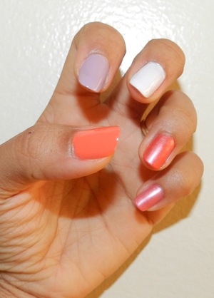 The left hand is more modest: each nail its own color.