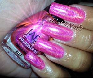 Wow this is one amazing color the pink is so vibrant and the rainbow in the holo is so beautiful.