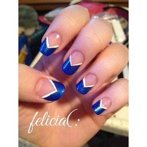 I used tape to mask the bottom part of the nail off. Then I used two coats of Sinful Colors Blue By You. After peeling the tape off, I used a thin coat of Seche Vite. After they dried, I used LA Colors Art Deco in White. Then all topped with Seche Vite. 