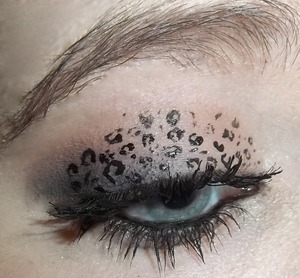 Neural eye with leopard spots! Sorry about the spider lashes; this was about the third consecutive look that we did, and her lashes suffered from that. 