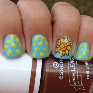 For the "yellow" day of our challenge I decided to do a yellow sunflower and some dots. 
Http://polishmeplease.wordpress.com 