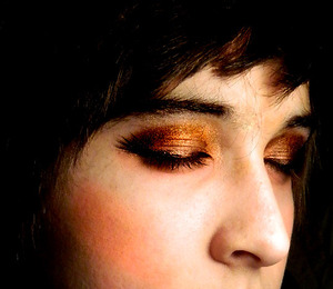 the title says it all...it involves golds, shimmery browns and black eyeliner...plus a peach blush