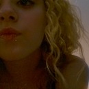 blond curly hair funny faces and a lip piercing 