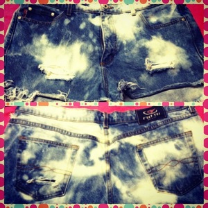 Bleach cut off shorts with areas of distress 