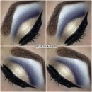 Dark blue cut crease and pale gold lid 