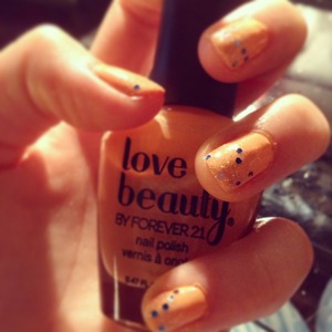 Forever21 nail polish in light orange. 😘