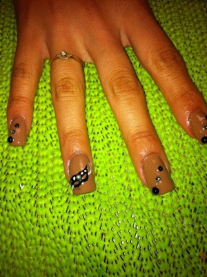 Masquerade mask with black and silver rhinestones on each nail. 