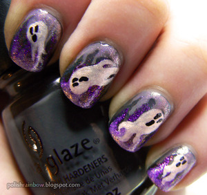 Little ghosts flying around in a purple and grey creepy background.

For more pictures and all the different colours used, the blog post is here:

http://polishrainbow.blogspot.com/2012/10/this-is-halloween-nail-art-challenge.html