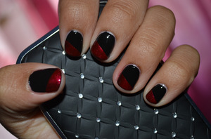 A simple nail design ; gloss black with a shimmery red diagonal tip. (This design works well with most colours, and most finishes)