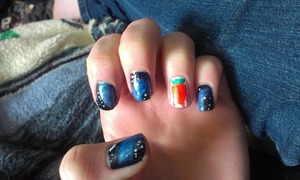 Nails with the universe on them, and a strawberry on the ring finger.  It was really easy to do. 