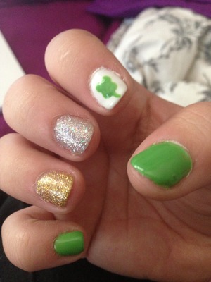 At pattys nails with a clover, green and glitters 