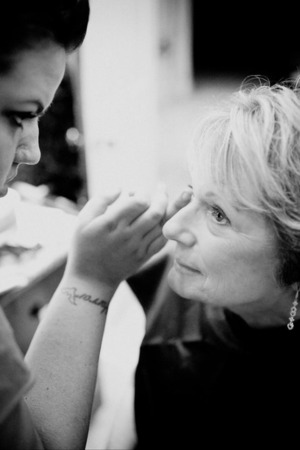 Applying makeup to Carol for her 50th wedding Anniversary party.