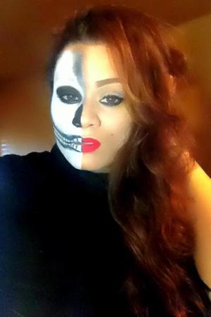 Halloween fun...My attempt at the halfarilyn and skull look.... I used some face paint from party city, carbon by mac for the eye..