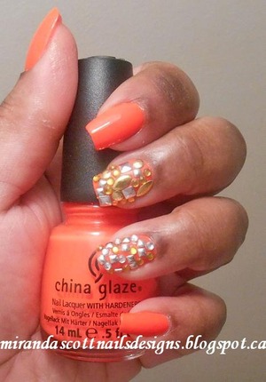 For this manicure I used a bright neon orange, China Glaze Japanese Koi. I added a variation of Studs and Rhinestones to my two middle fingers to accent the nails.