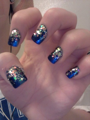 Blue nails with multi size glitter fade
