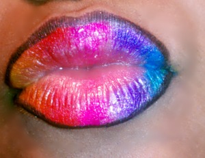 MY TAKE ON RAINBOW LIPS OUTLINED WITH A BLACK EYE LINER. RAINBOW COLORS ARE EYESHADOWS 