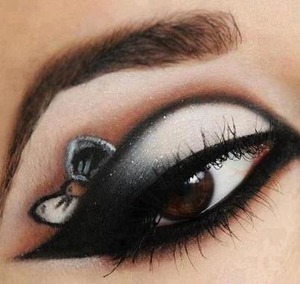 Beautiful winged eyeshadow with a bow to top it off.