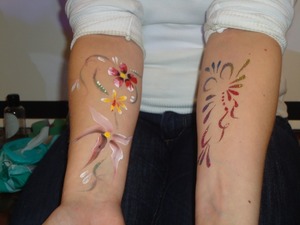 Glitter tatoo and a paint tatoo
