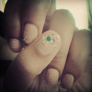 With jewels on the thumb making a bow <3
