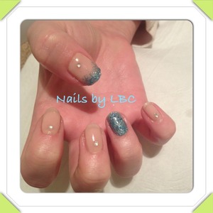 Tru-gel nails 
Base canvas with one coat tutu with gems and lots of blue glitter 