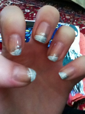 Slanted French manicure with silver glitter