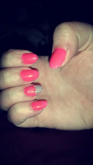 gel nails done by my friend at her work. 
bright pink, glitter tip on ring finger 