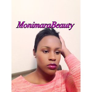 Neutral face with a bold plum lip