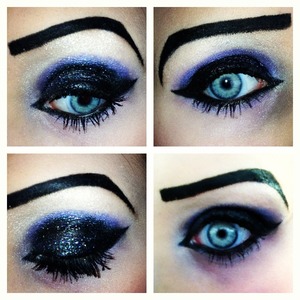 Glittery black eyeshadow with purple crease and cat eye.
