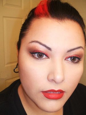 neutral eye will a line of red glitter and red lips
