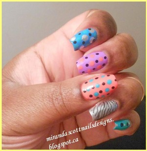 For the below manicure I did a skittles manicure with colourful polka dots. I like these types of manicures especially in the summer time it's bright and fun. The polishes I used were Sally Hansen Coral Reef, Sally Hansen Blue me Away, Sally Hansen Black Out and Celb City. And also used China Glaze That's Shore Bright and China Glaze Four Leaf Clover. 