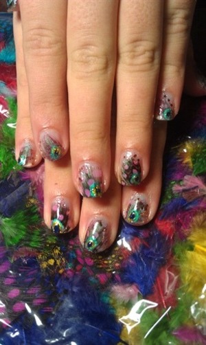 painted these nails on my older sister, used real feathers and painted on details :)