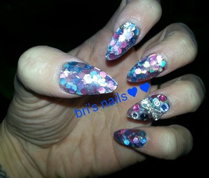 glitter mix i made w/ pink,blue, silver , and purple hexagons and silver 3d bow