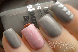 Grey and pink nails. Pink with polkatdots and grey with hearts.