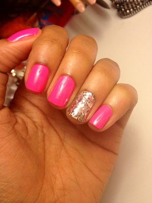 Hot pink nail polish with a sparkle mix. 