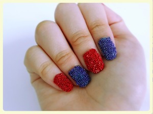 This is a photo on red and blue caviar nails. I tried this for the first time and it turns out I like it (: I have a video on how I did it (: 