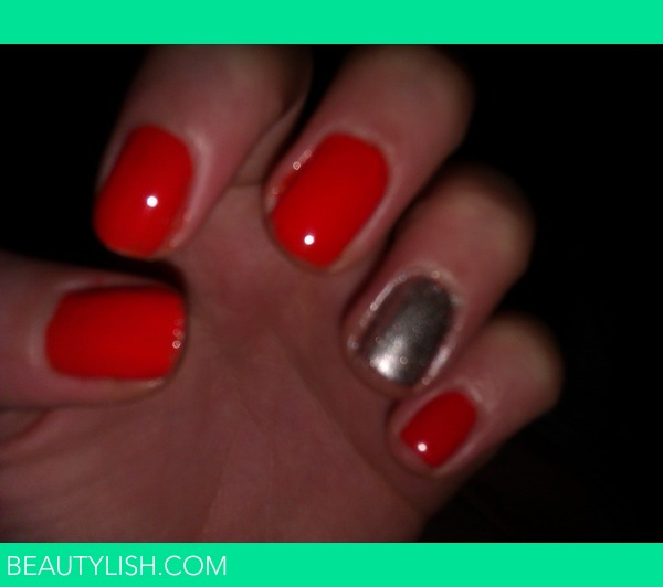 Premium Photo | Dark orange and black manicure on long sharp nails close up  on a white background leaf nails