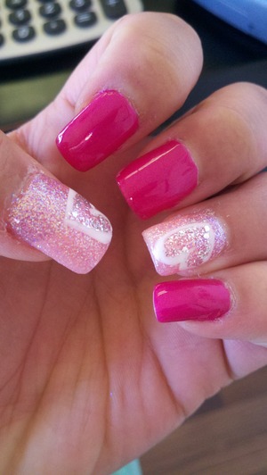 Pink nail polish with white hearts