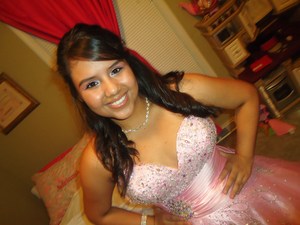 For Andrea's Quinceanera, I covered her lid in a light pink, and then put a darker pink in her crease. I highlighted her brow bone and tear duct, then I filled in her eyebrows and gave her dark liner. 